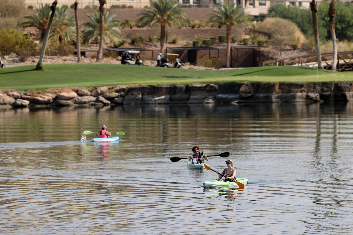 Kayakers, from left, Kimberly Jones with Brutus, Josh Brooks with Bane and Kelly Brooks with Sh ...