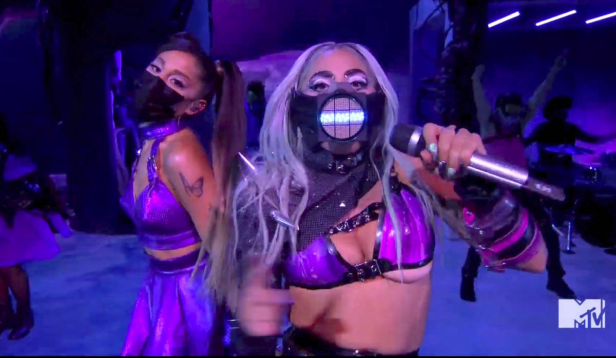 In this video grab issued Sunday, Aug. 30, 2020, by MTV, Ariana Grande, left, and Lady Gaga per ...