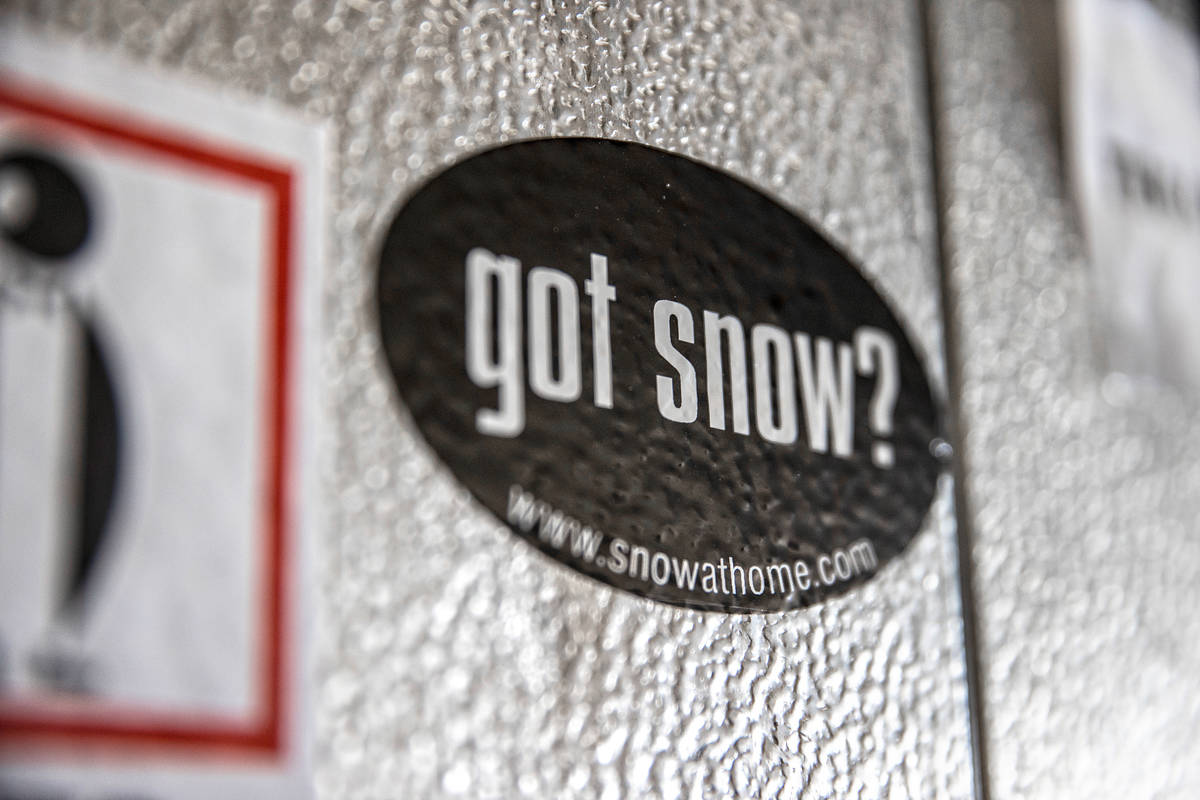 Stickers advertising Marco Villarreal"s business line the freezer where he makes his ice s ...