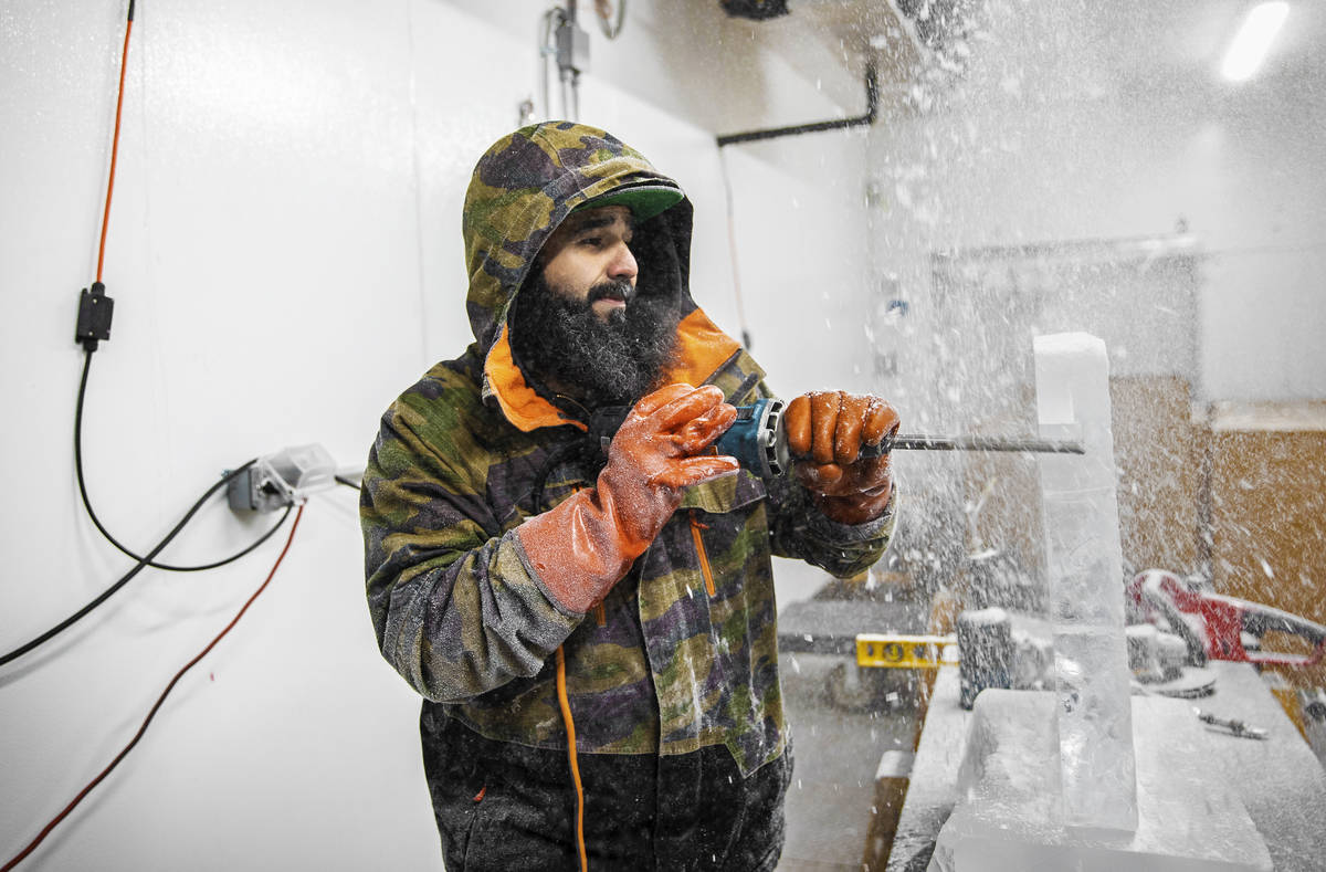 Marco Villarreal, known as "Vegas Ice Man," works on an ice sculpture on Tuesday, Sep ...