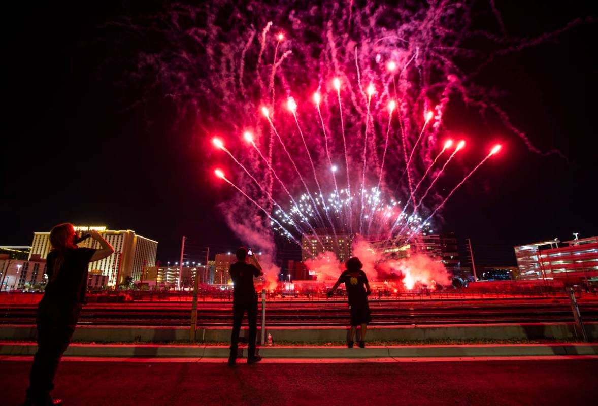 Entertainment workers watch as fireworks go off at the Core Arena at the Plaza for the "Re ...