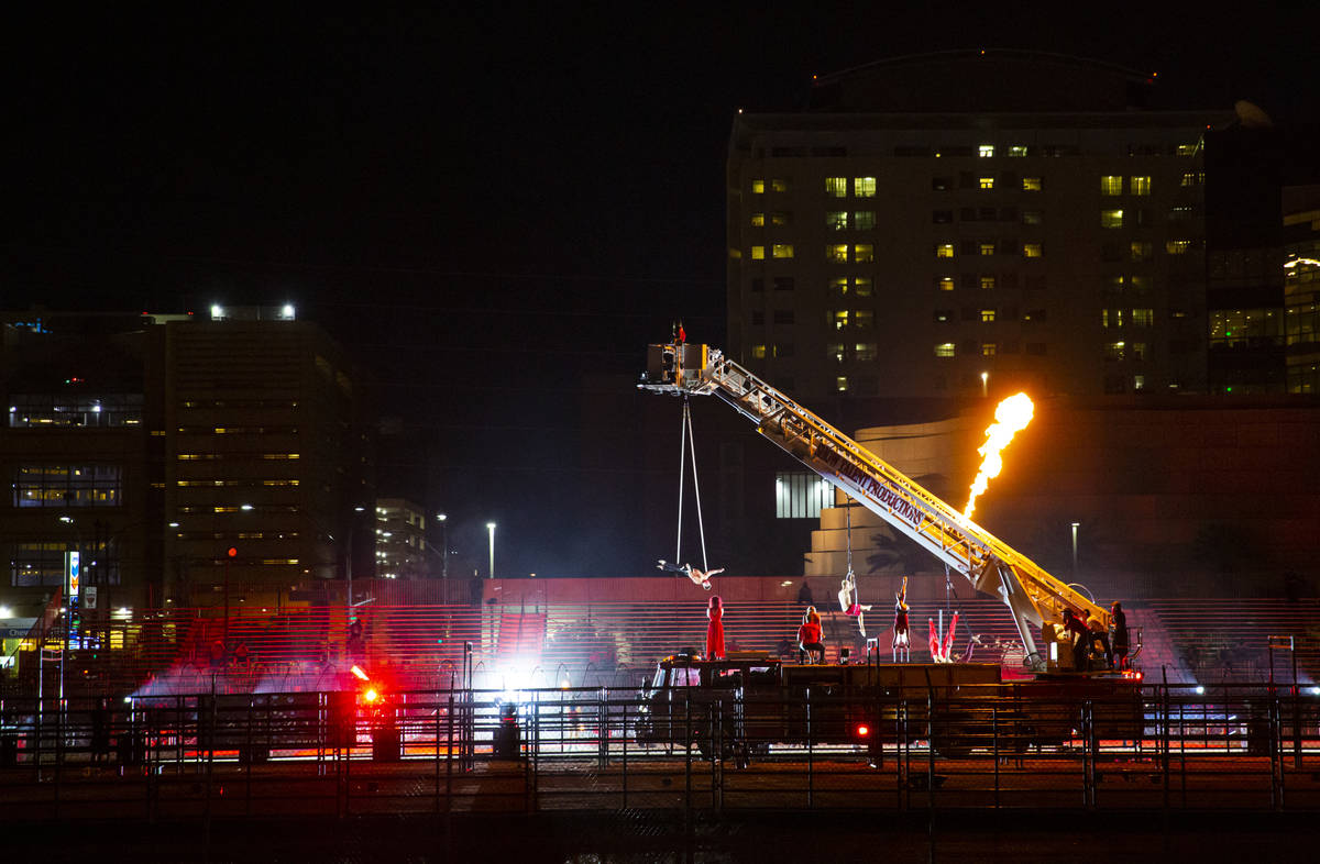 People perform at the Core Arena at the Plaza for the "Red Alert" campaign in downtow ...