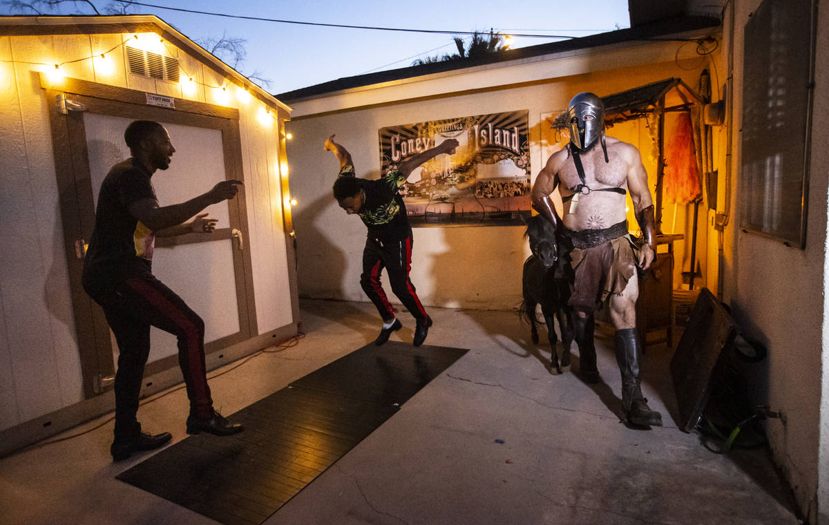 Twin tappers Sean and John Scott and Erik Martonovich of "Gladius the Show" and a mini-horse ar ...