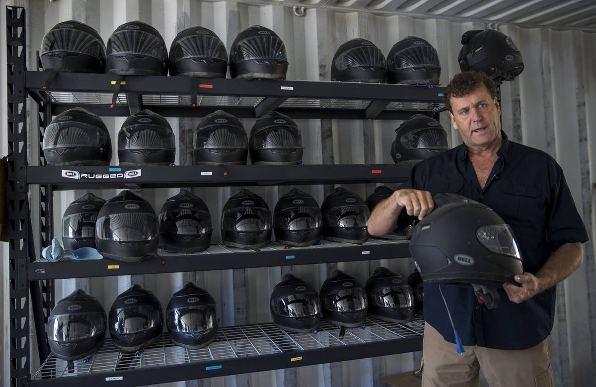 Adrenaline Mountain owner and CEO Eric Brashear with one of the safety helmets guests must wear ...