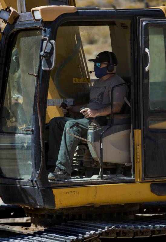 Christopher Lawrence operates a Caterpillar Excavator, one of the extreme outdoor entertainment ...