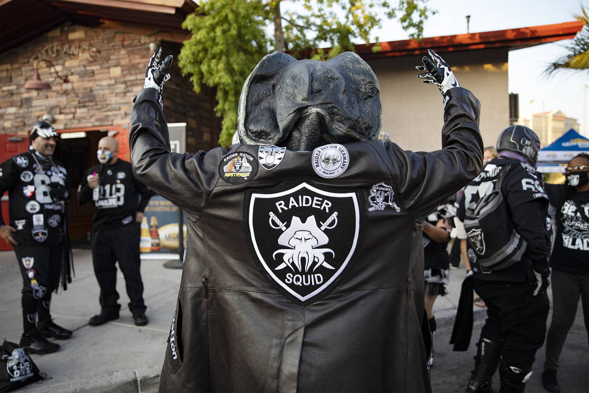 Raiders Squid shows off his jacket at a Raiders party at Tommy Rockers in Las Vegas, Sunday, Se ...