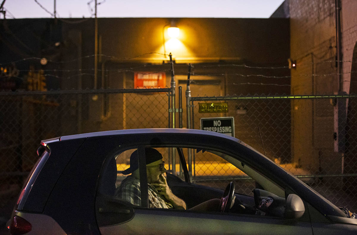 Director Troy Heard watches from his car during a rehearsal of "The Parking Lot" outs ...
