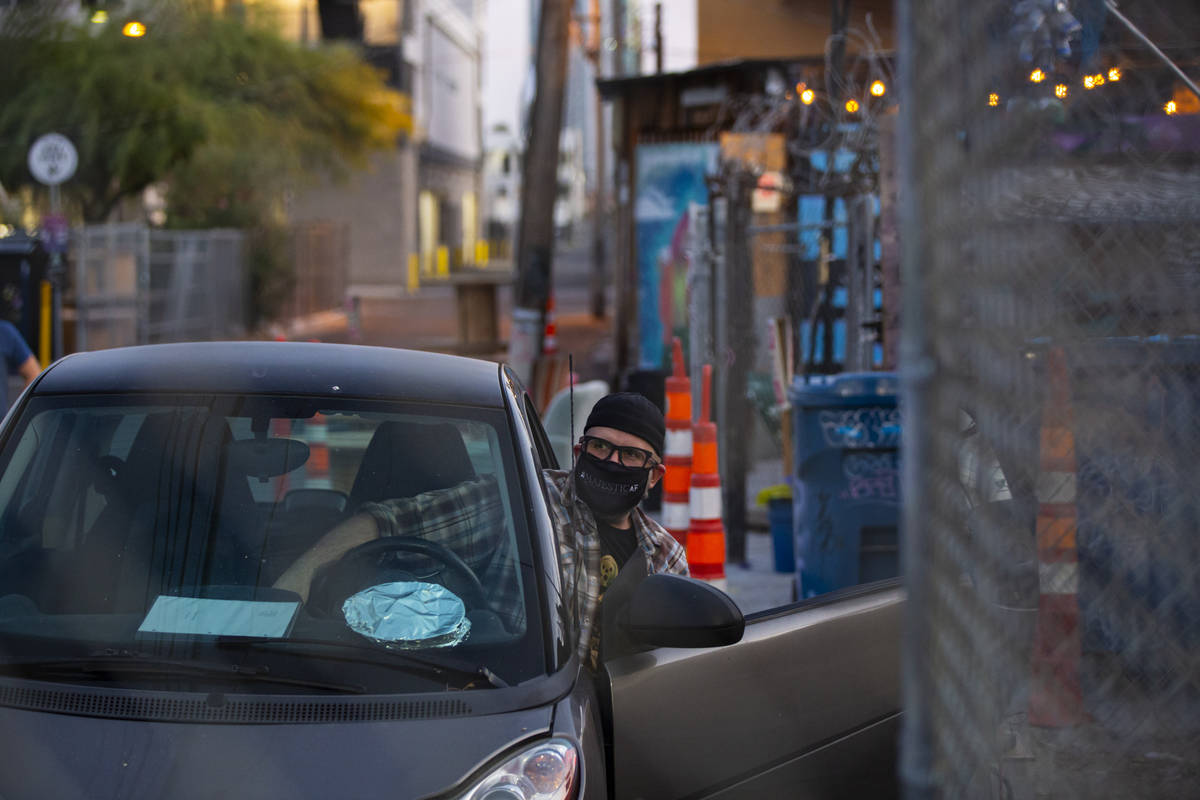 Director Troy Heard looks out from his car before the start of a rehearsal of "The Parking ...