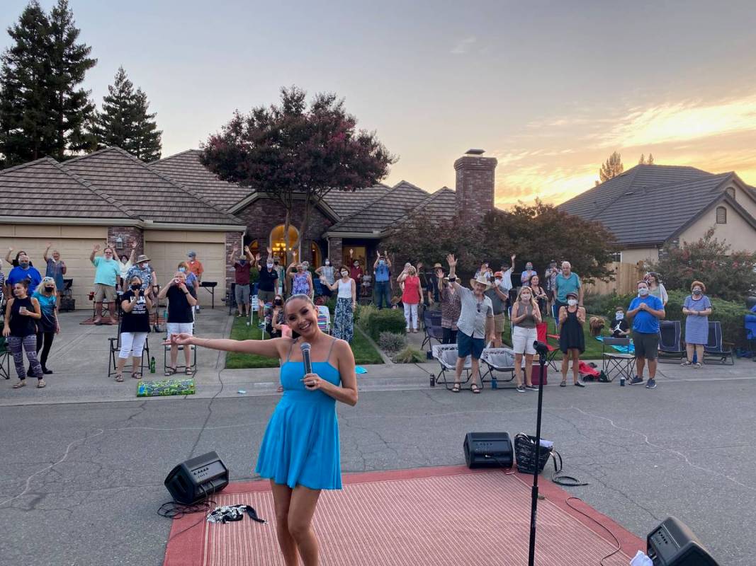 "Fantasy" singer Lorena Peril is shown singing during "“The Vegas On Wheels Mobile Music and ...