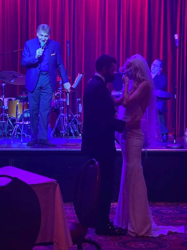 Carmine Mandina sings to a pair of newlyweds at Italian American Club on July 26, 2020. (John K ...