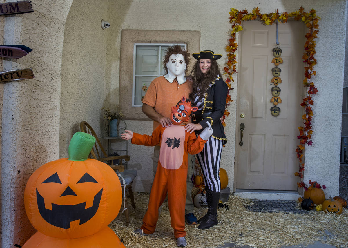 (Clockwise from bottom) Alex Montenegro, 8, with parents Joe and Kim Cabrero in costumes with t ...