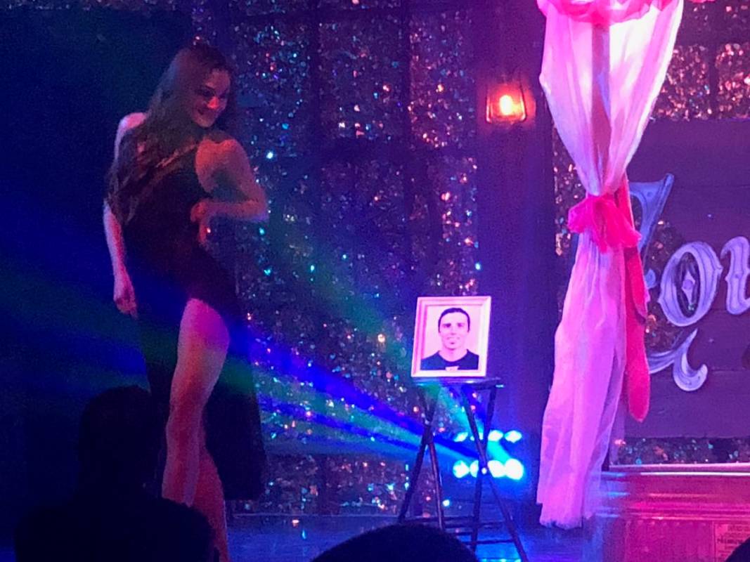 JoLae Brandt of "X Country" at Harrah's dances as a photo of Vegas Golden Knights goalie Marc-A ...
