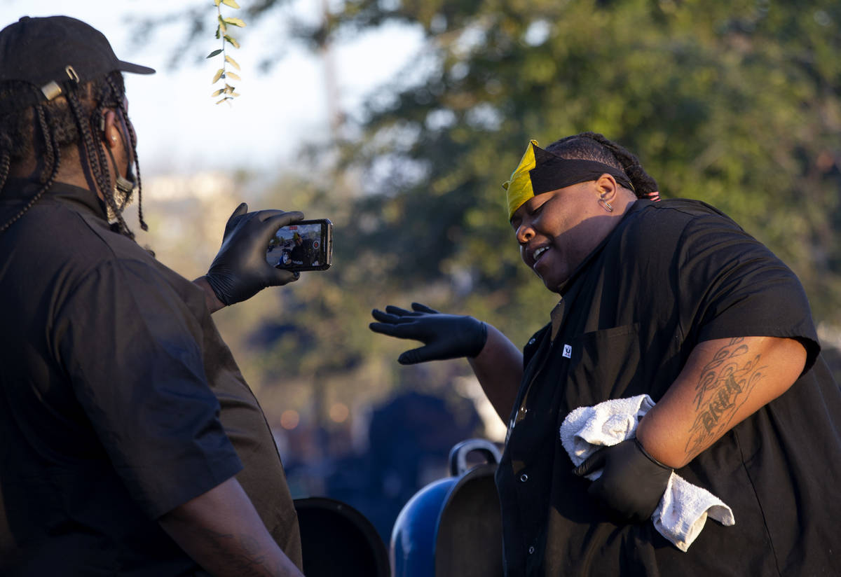 Shabrayia ÒChef BrayÓ Woodall dances while cooking at a Noir Culinary Experience even ...