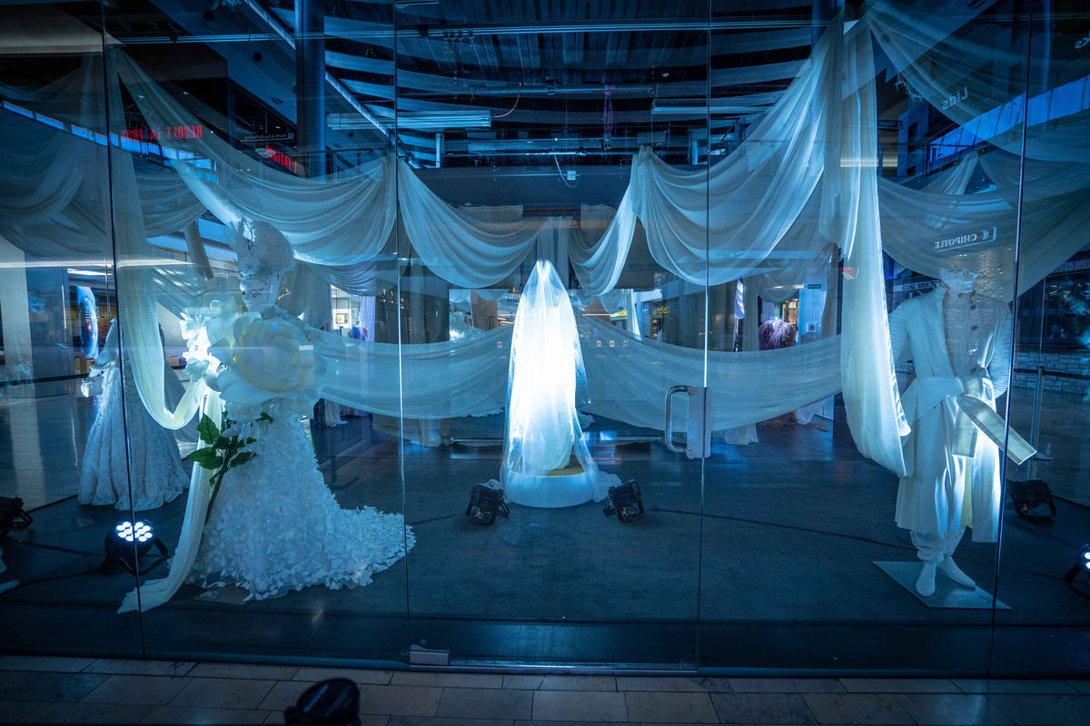 The Great Hall to snap photos of a spider web installation and mummy fashion exhibit. (Fashion ...