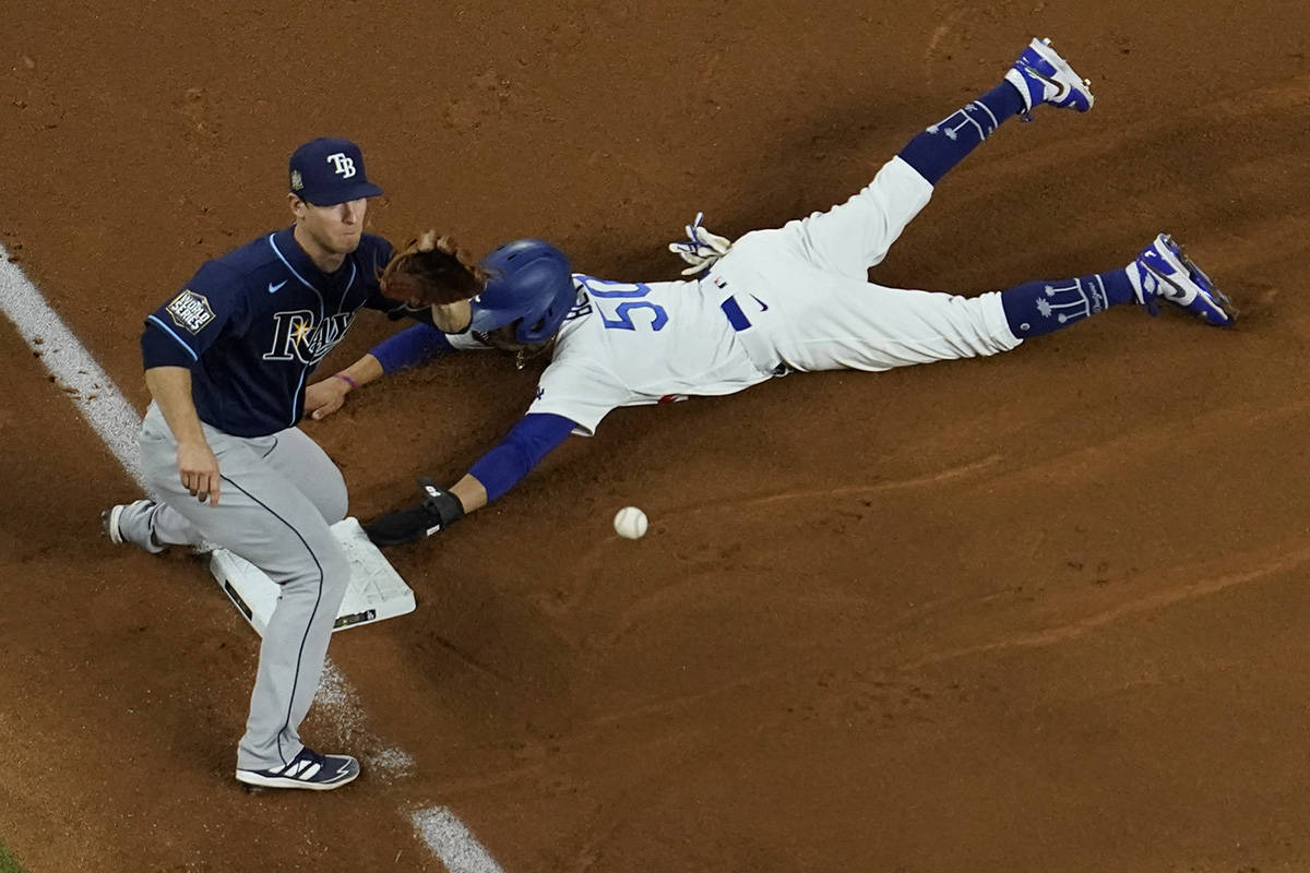 Los Angeles Dodgers right fielder Mookie Betts steals third past Tampa Bay Rays third baseman J ...
