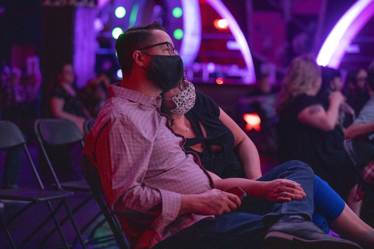 Will and Amy Stutz of Las Vegas listen to Shanda & the Howlers preform as live music return ...
