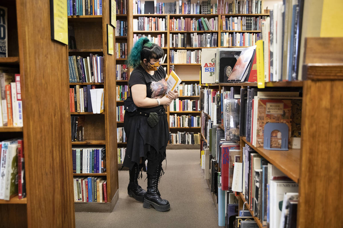Mad Ange Khan shops for books at Amber Unicorn Books in Las Vegas, Wednesday, Oct. 21, 2020. Th ...