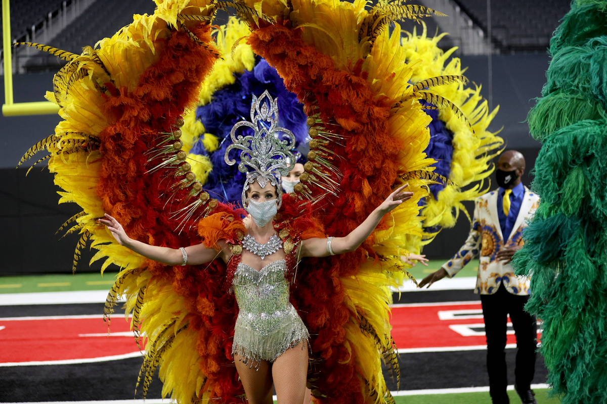 Las Vegas performers, including Jennifer Jordan, front, put on a show at Allegiant Stadium as p ...