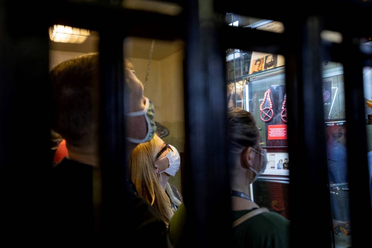 Tourists from Jackson, Georgia, look at Charles Manson's bone fragments during a tour at Zak Ba ...
