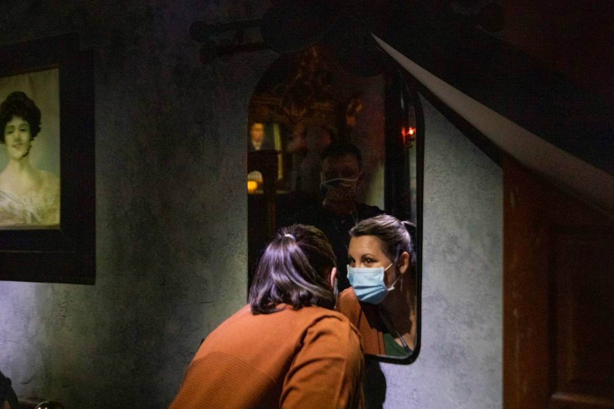 Deanna James, 46, and Jerry James, 50, of Jackson, Georgia, look into Bela Lugosi's haunted mir ...