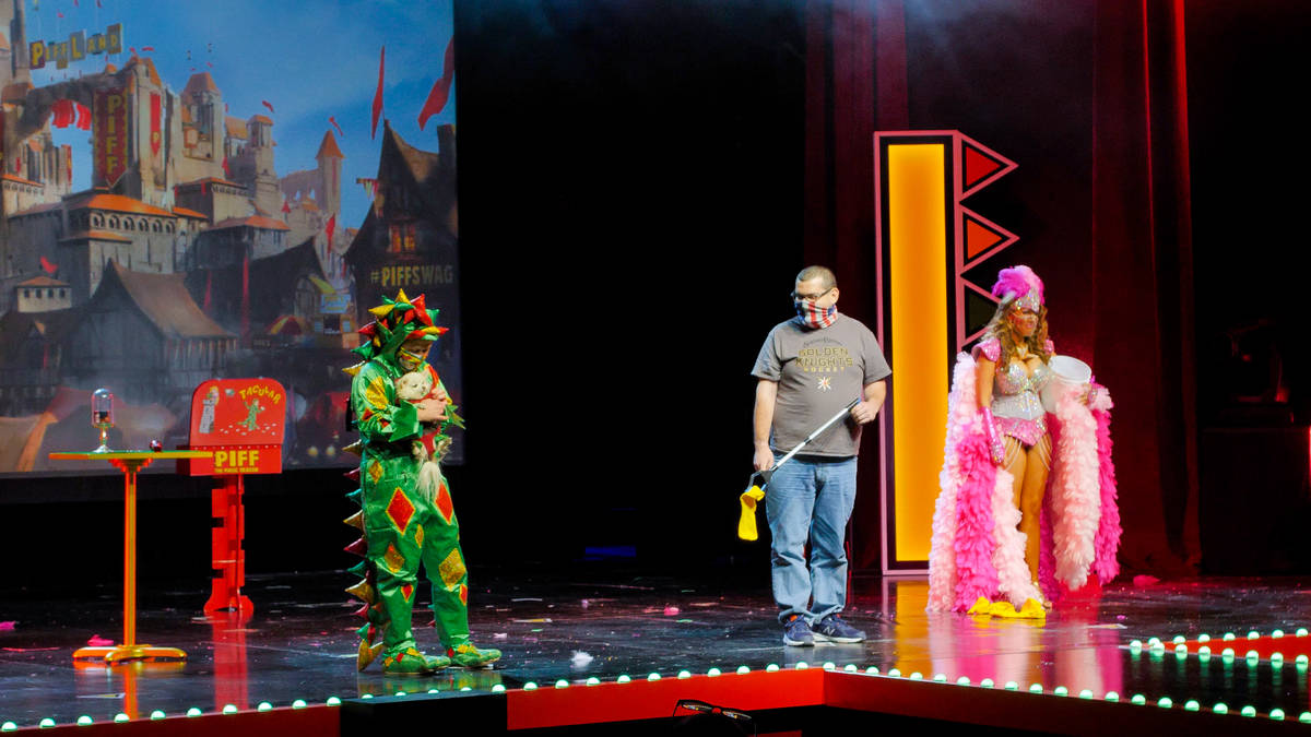 Piff The Magic Dragon (John van der Put), the Squire (Brett Alters) and showgirl Jade Simone ar ...
