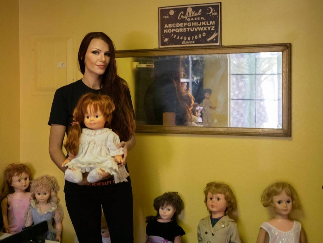 Paranormal enthusiast Staysha Randall is seen in a room connected to her garage that houses ite ...
