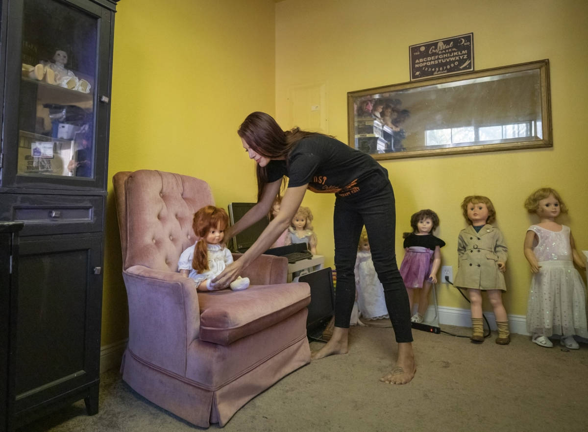 Paranormal enthusiast Staysha Randall is seen in a room connected to her garage that houses ite ...