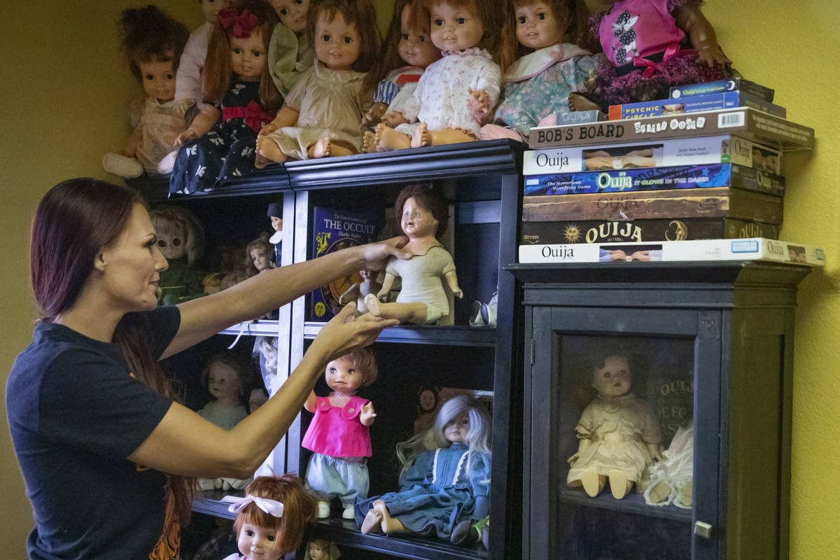 Paranormal enthusiast Staysha Randall is seen in a room connected to her garage that houses ite ...