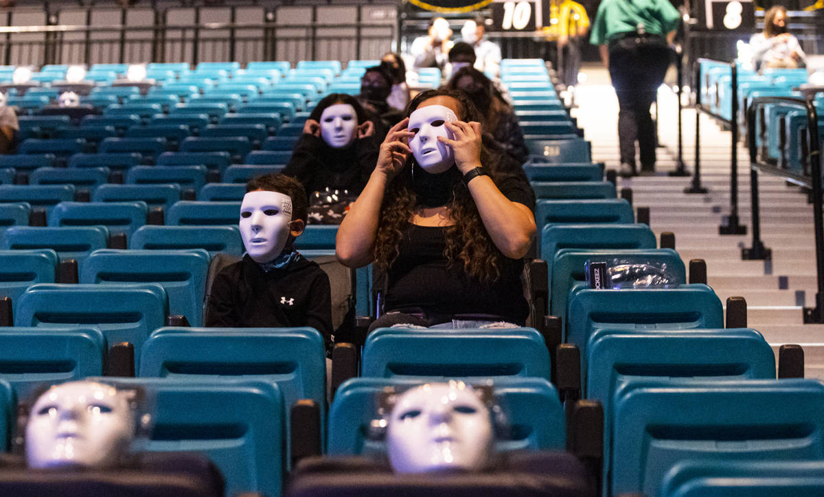 People pose in their Jabbawockeez masks before the beginning of the group's new production, &qu ...