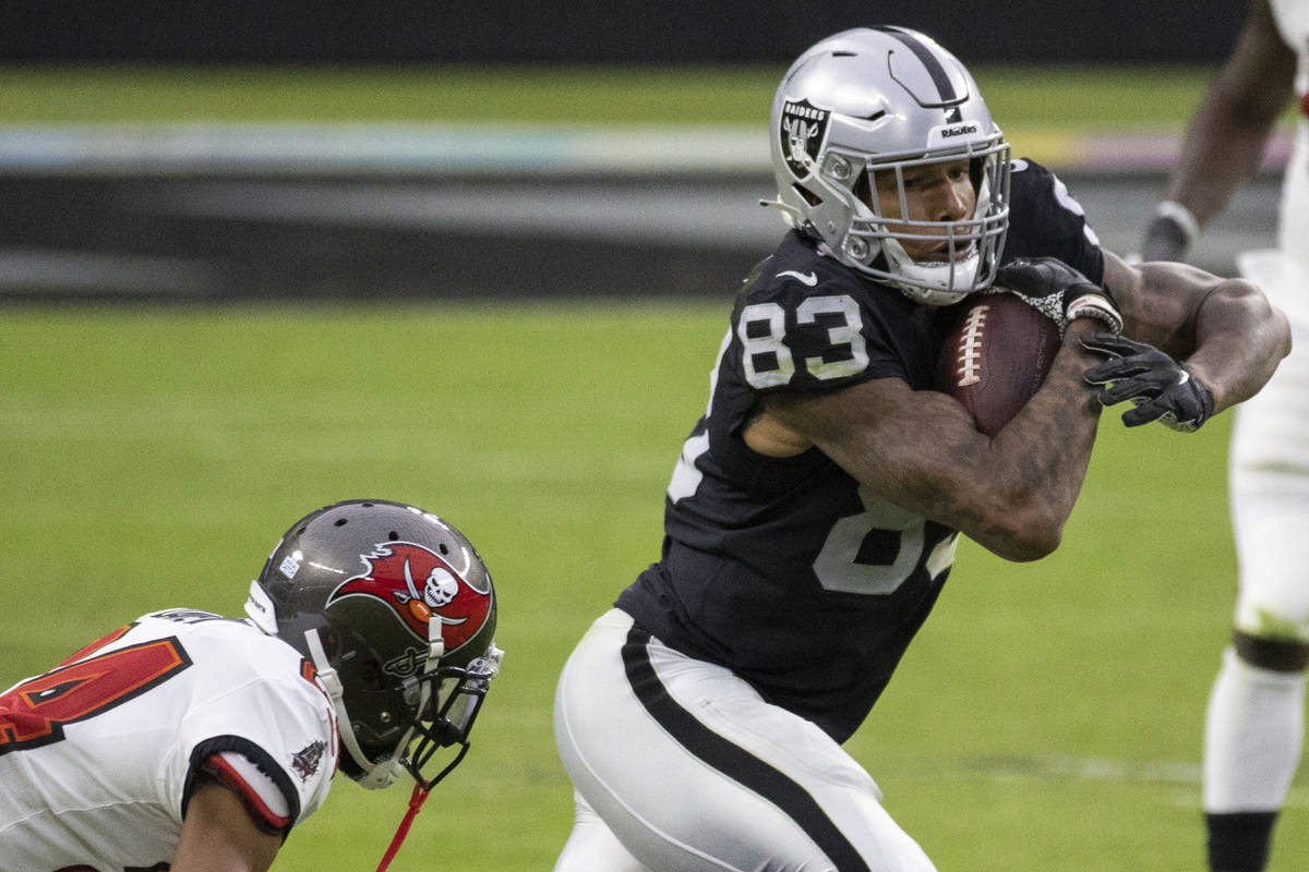 Las Vegas Raiders tight end Darren Waller (83) cuts up field past Tampa Bay Buccaneers cornerba ...