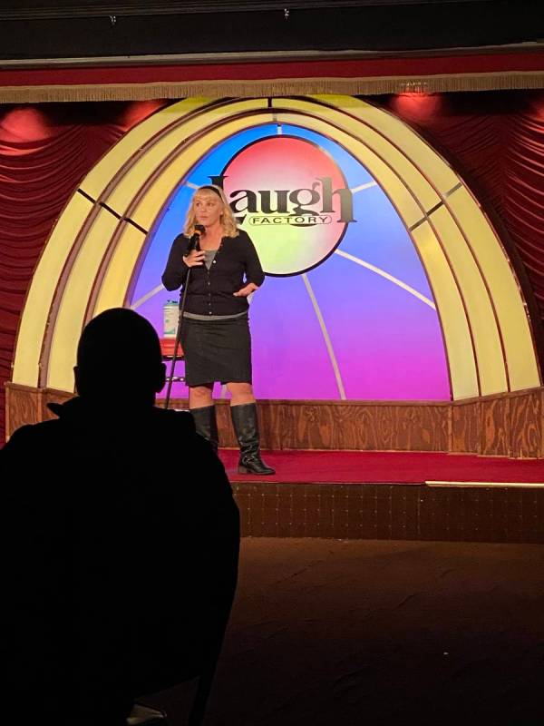 Veteran comic Traci Skene is shown onstage for a socially distant audience at Laugh Factory at ...