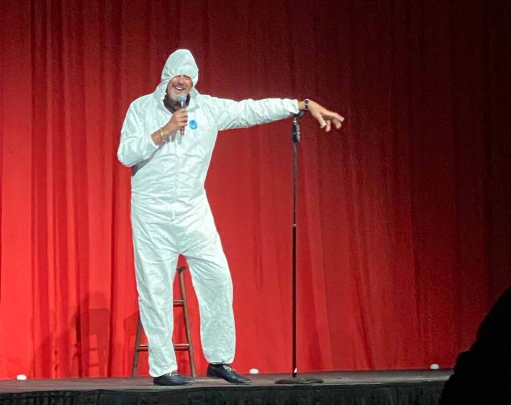 Brad Garrett is shown wearing his protective hazmat suit at the reopening of his Brad Garrett's ...