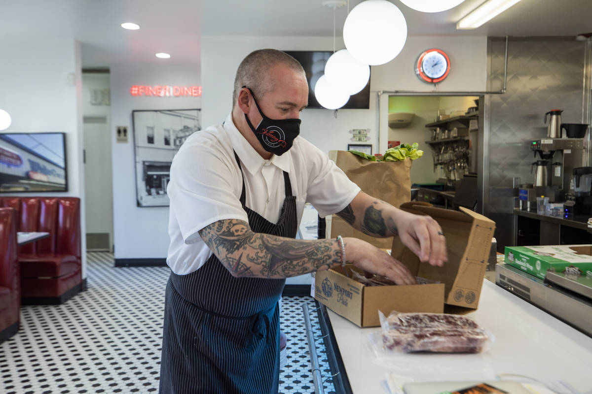 Chef Johnny Church goes through a mystery box of ingredients to prepare 24 meals for people in ...