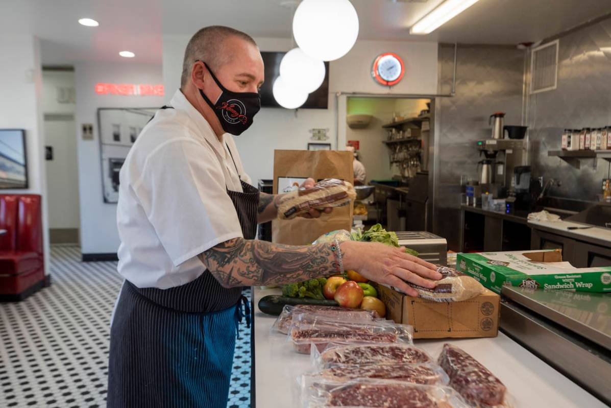 Chef Johnny Church goes through a mystery box of ingredients to prepare 24 meals for people in ...