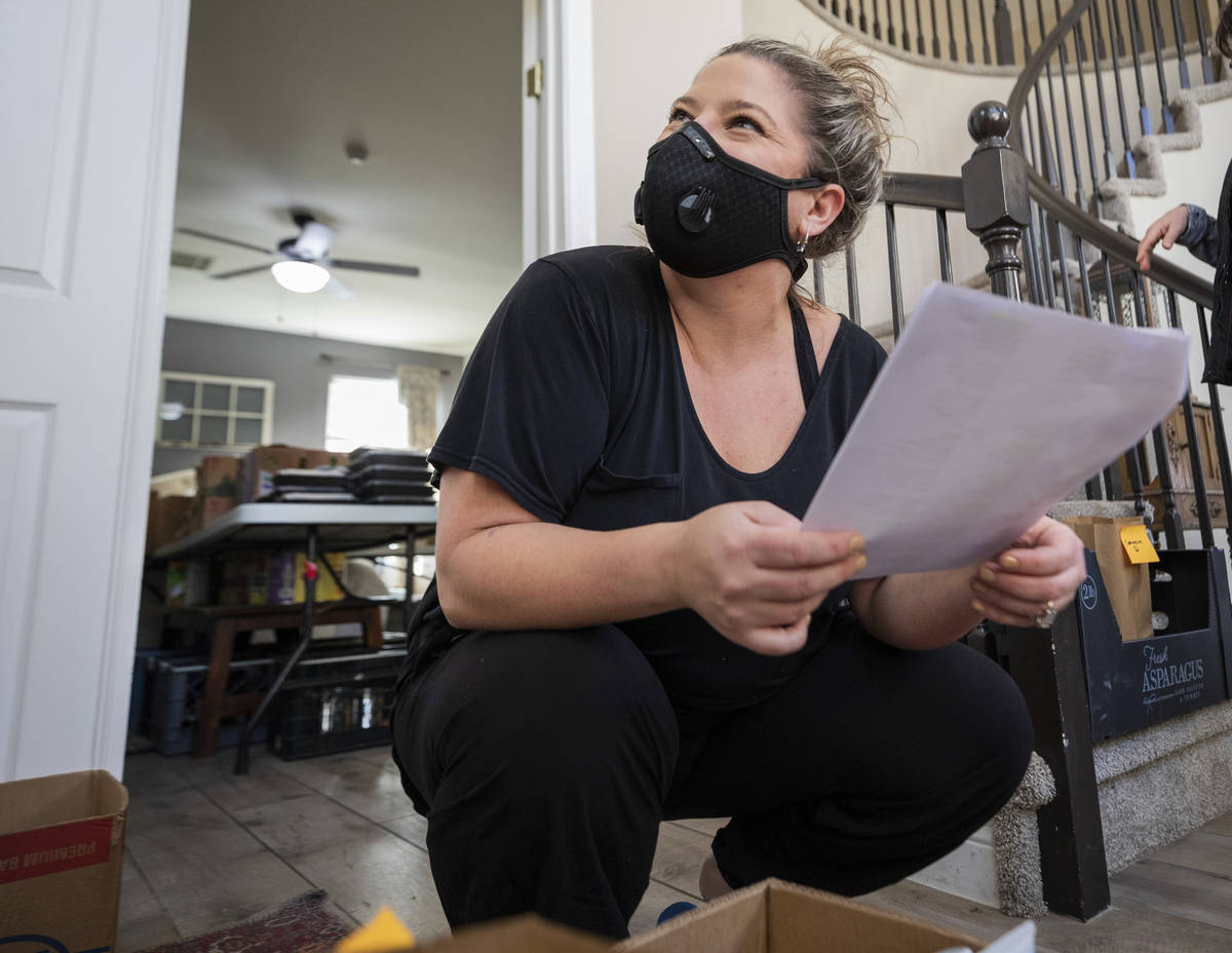 Katinka Fresinski, founder of 24Meals, collects addresses to distribute to volunteers that deli ...