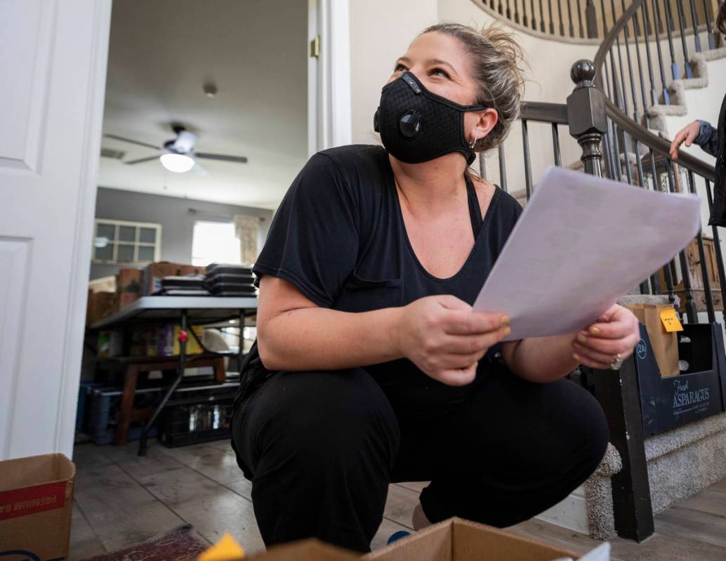 Katinka Fresinski, founder of 24Meals, collects addresses to distribute to volunteers that deli ...