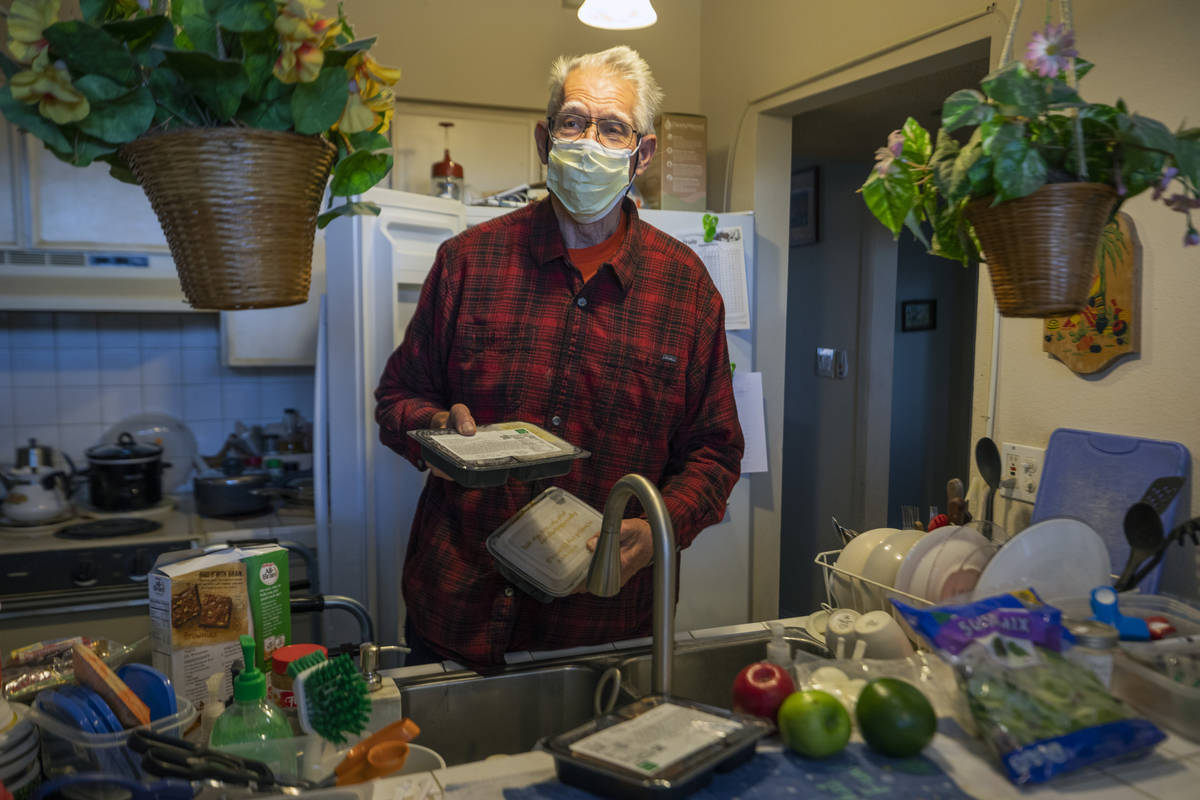 Wendell, last name not disclosed, unpacks holiday inspired meals created by local chef Johnny C ...