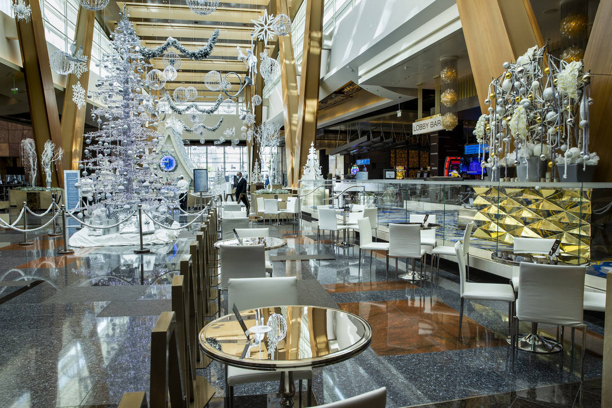 A small dining area is apart of the Aria unveiling of their holiday lobby display, a Sugar Pala ...