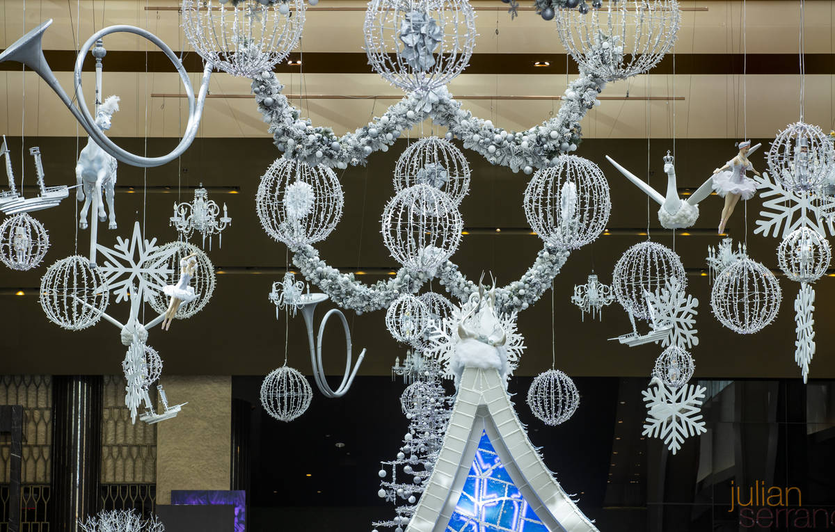Lighting and decorations hang from the ceiling as part of the Aria's Sugar Palace lobby display ...