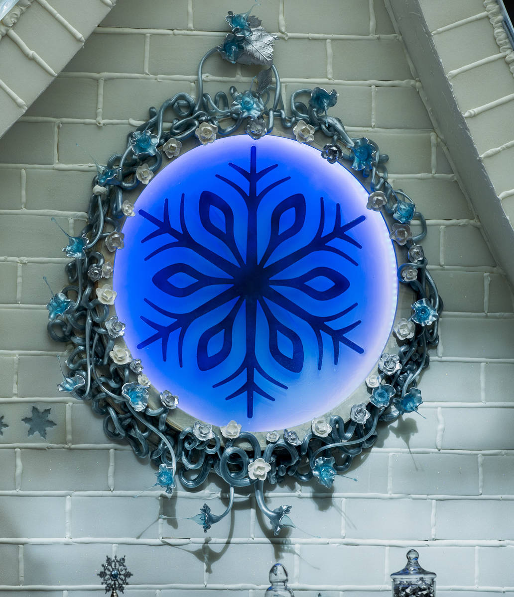 Seven various sugar techniques are employed including a decorative flower piece below the roof ...