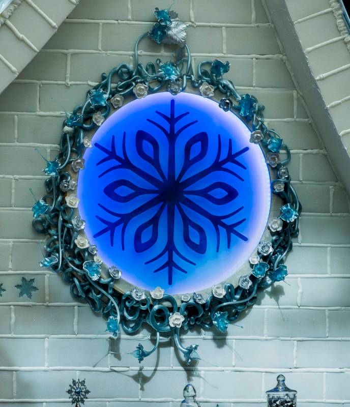 Seven various sugar techniques are employed including a decorative flower piece below the roof ...