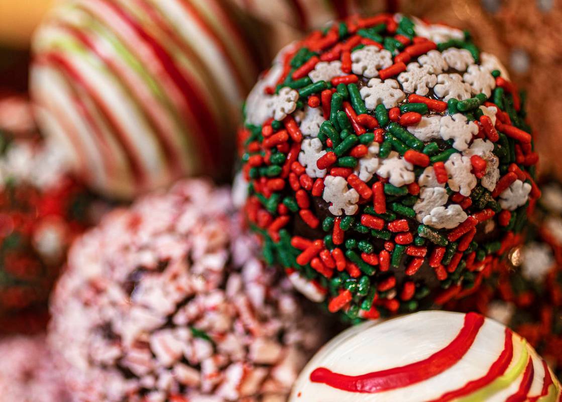 Cocoa bombs, the signature ingredient in a hot cocoa bomb cocktail, are chocolate balls filled ...