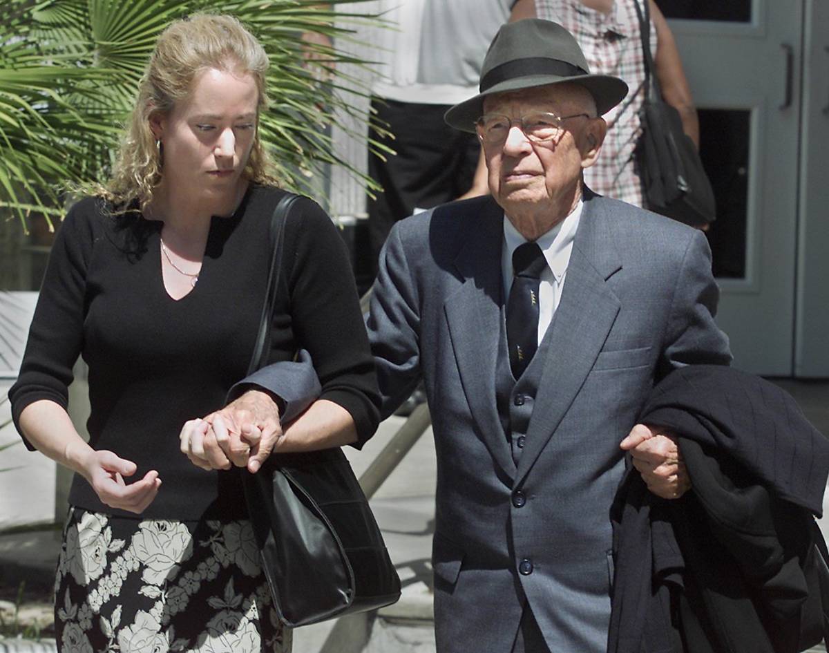 Dr Quincy Fortier is supported by his daughter, Nanette, after leaving district court following ...