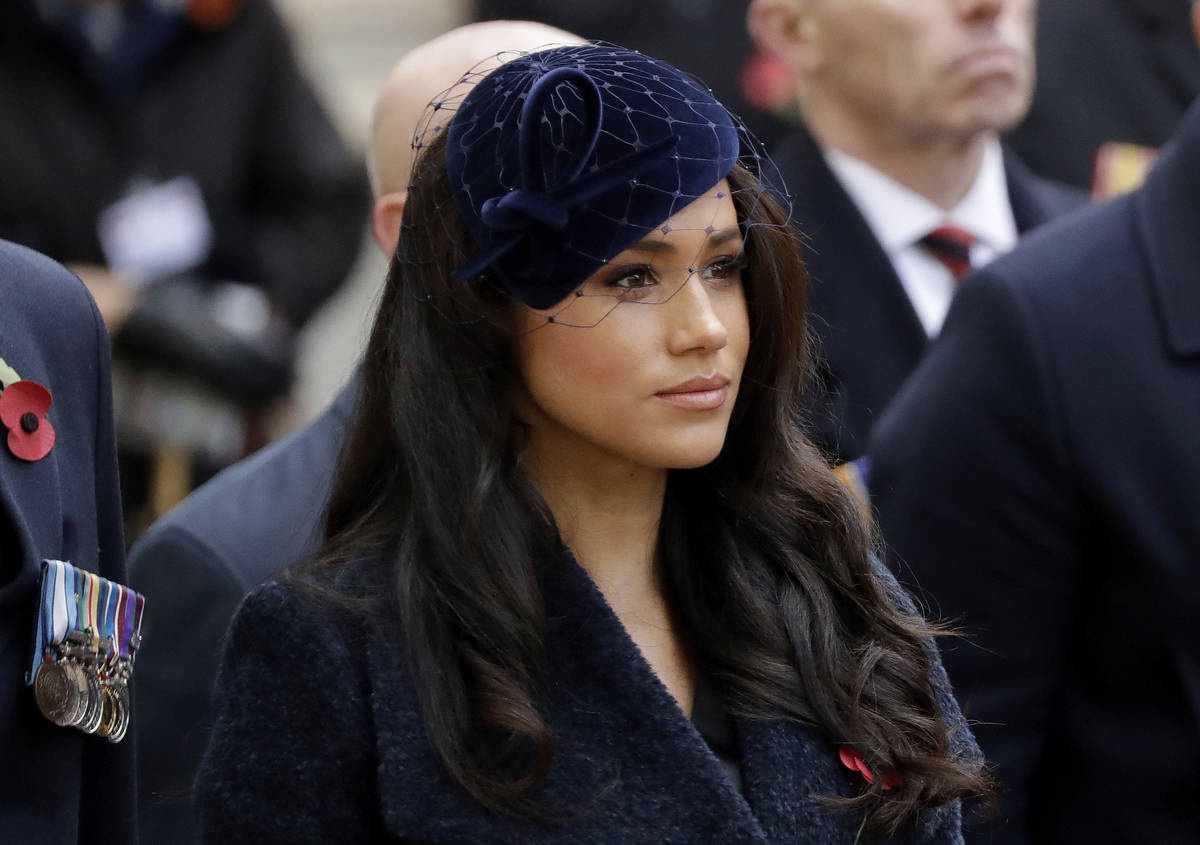 FILE - In this Thursday, Nov. 7, 2019 file photo Meghan the Duchess of Sussex stands after she ...