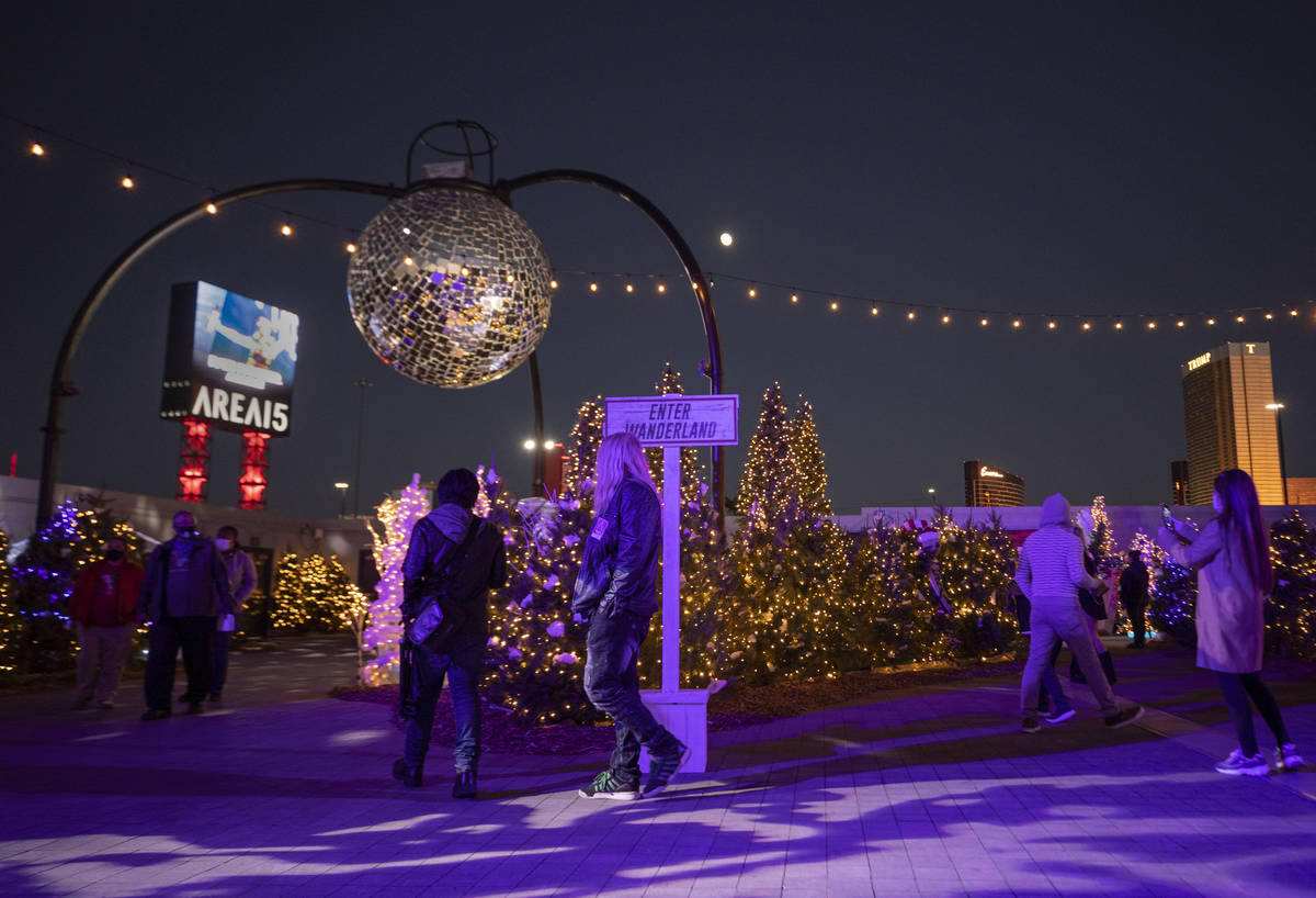 Individuals attend the kick off of "Wanderland" holiday experience at Area15 on Friday, Nov. 27 ...