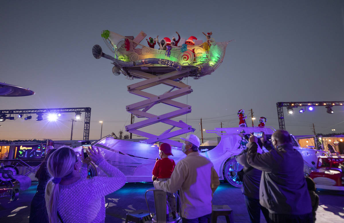 Toys are thrown to kids from a sleigh during the kick off of "Wanderland" holiday experience at ...