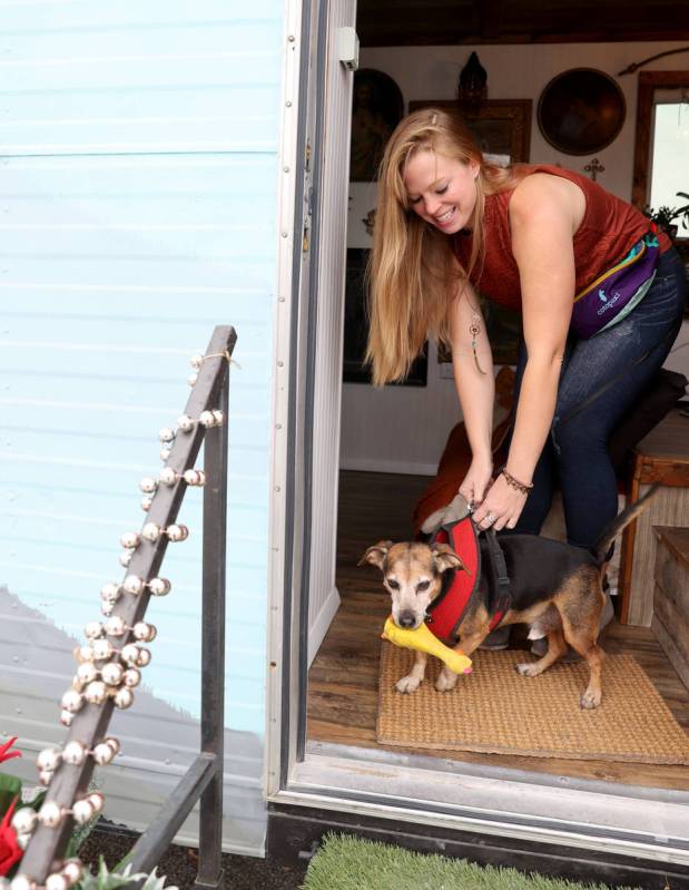 Hannah Doss and her dog Banjo at their tiny home in Boulder City Friday, Dec. 11, 2020. Doss bo ...