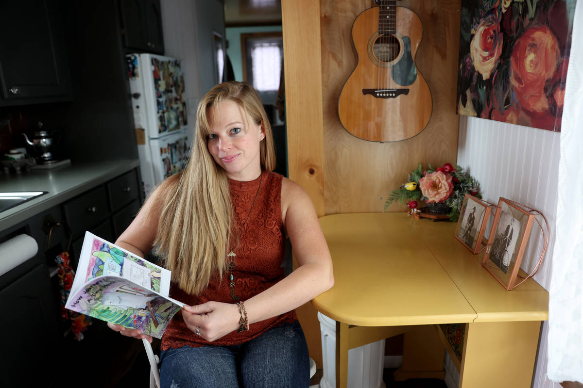 Hannah Doss and her book in her tiny home in Boulder City Friday, Dec. 11, 2020. Doss bought th ...
