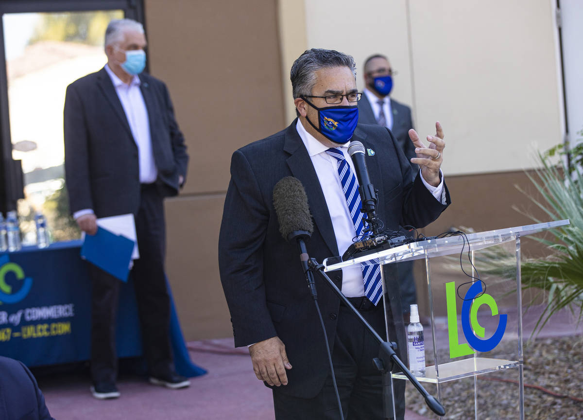 Peter Guzman, president of the Latin Chamber of Commerce, speaks during a press conference anno ...