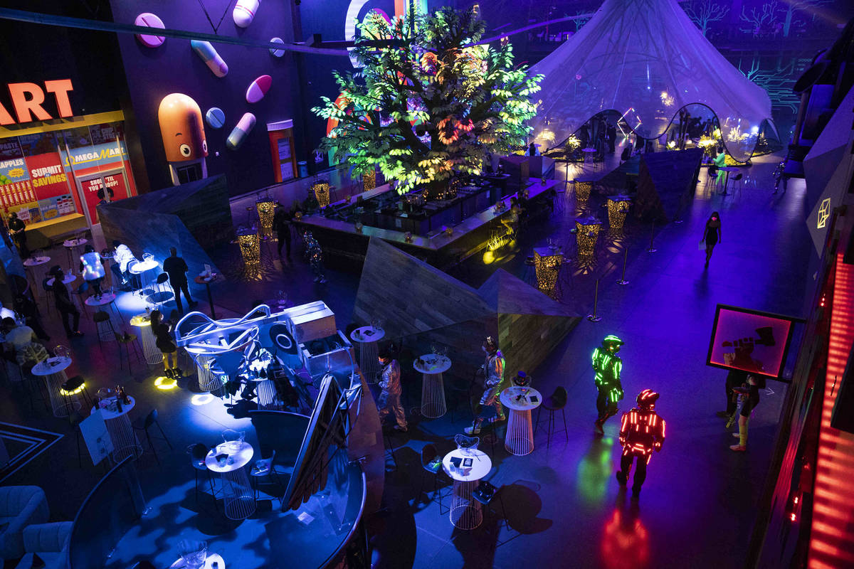 People attend the "Illuminate" New Year’s Eve celebration at Area15 in Las Vegas on Thursday, ...
